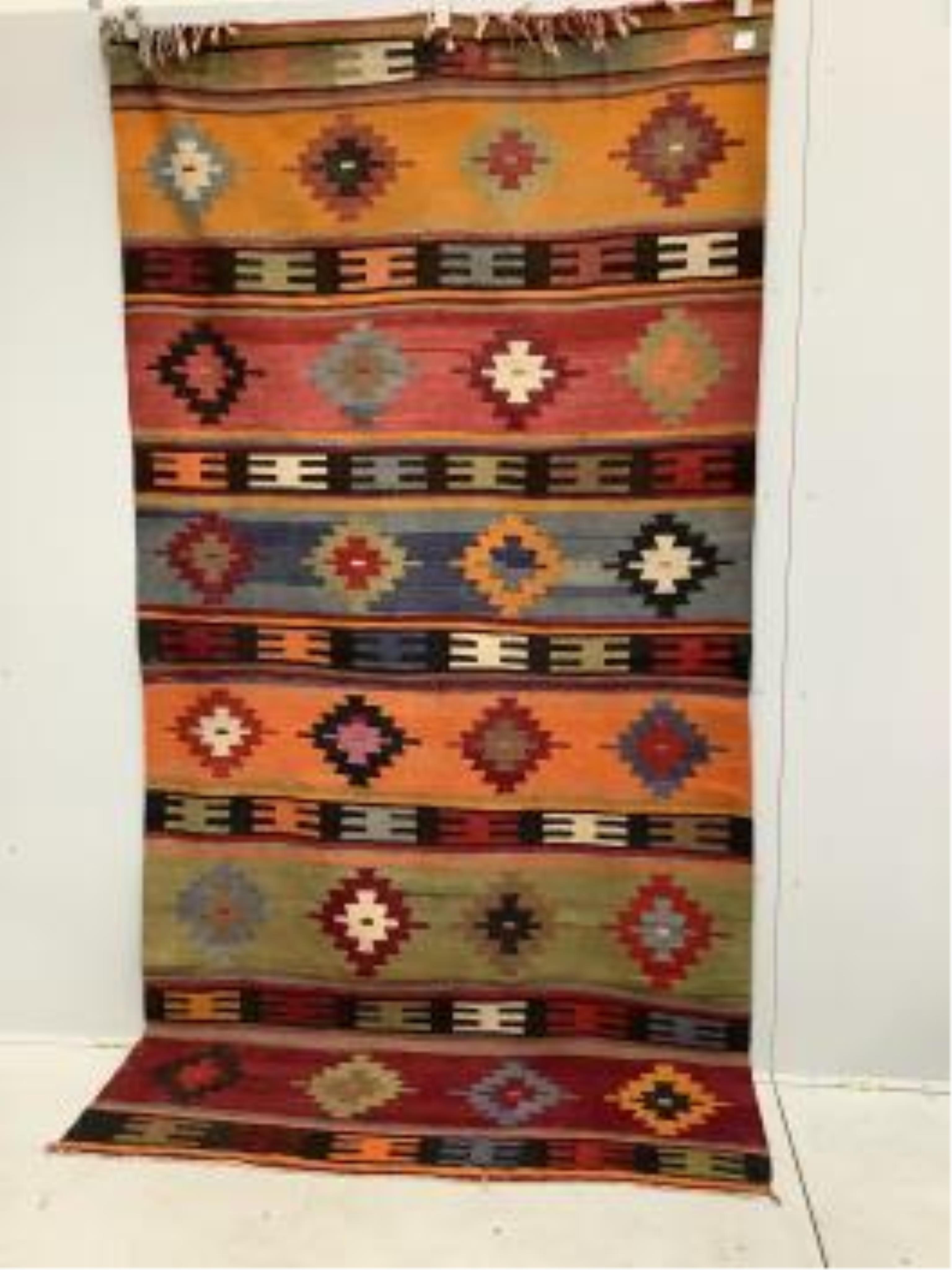 A Kilim polychrome flatweave rug, 280 x 140cm. Condition - fair